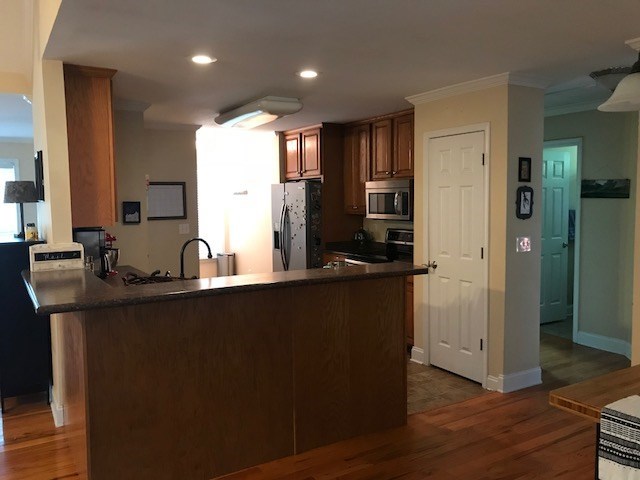 204 Ridge Point Way Macon, GA 31220 - Photo 6 of 22 a kitchen with stainless steel appliances granite countertop a refrigerator a sink and a stove