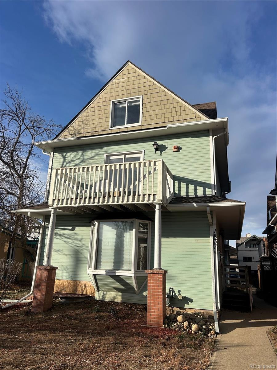 1837 Walnut Street Boulder, CO 80302 - Photo 1 of 6 a front view of a house with garden