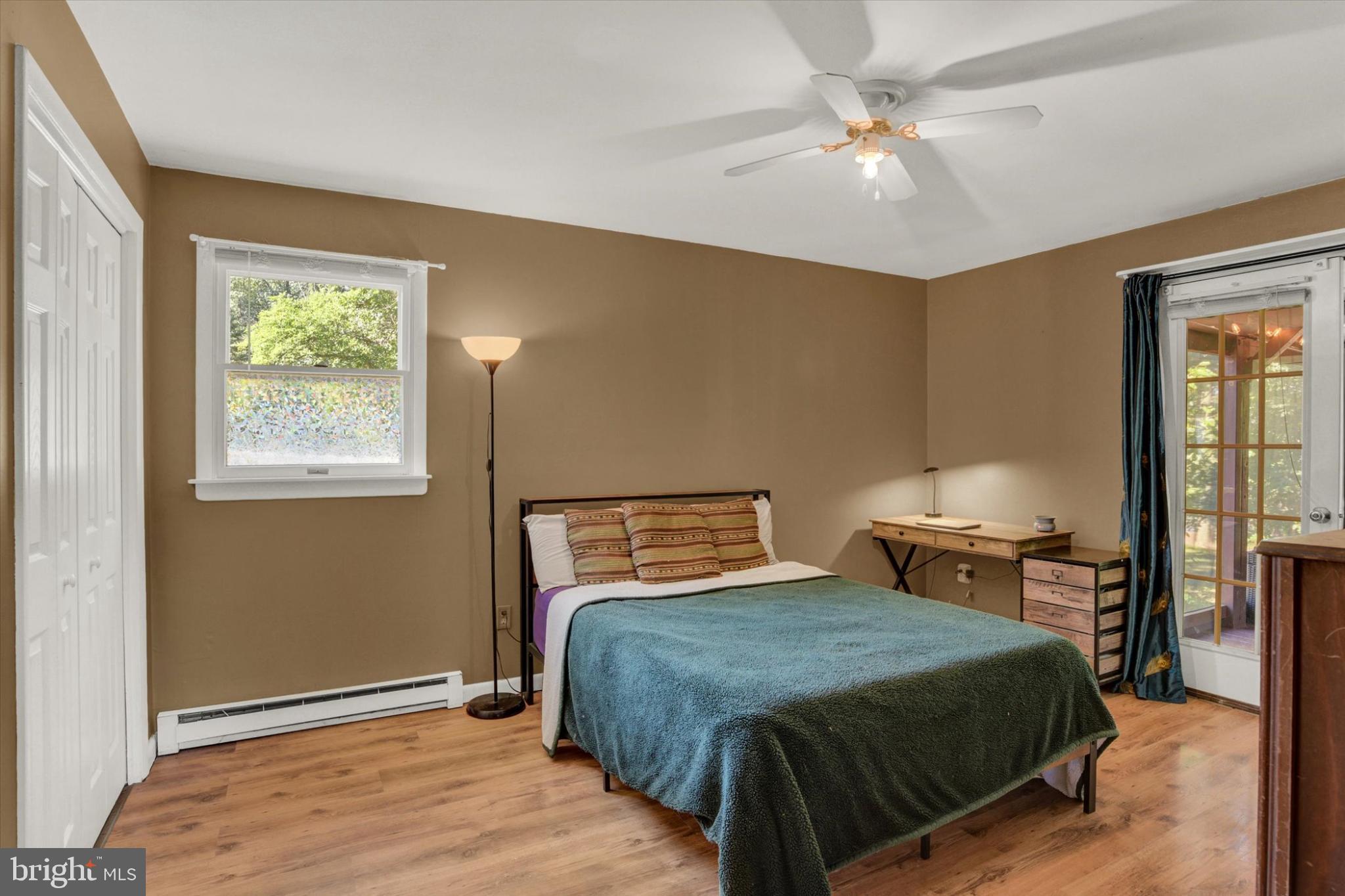 273 West Ridge Road Elizabethtown, PA 17022 - Photo 10 of 20 a bedroom with a large bed and a chandelier