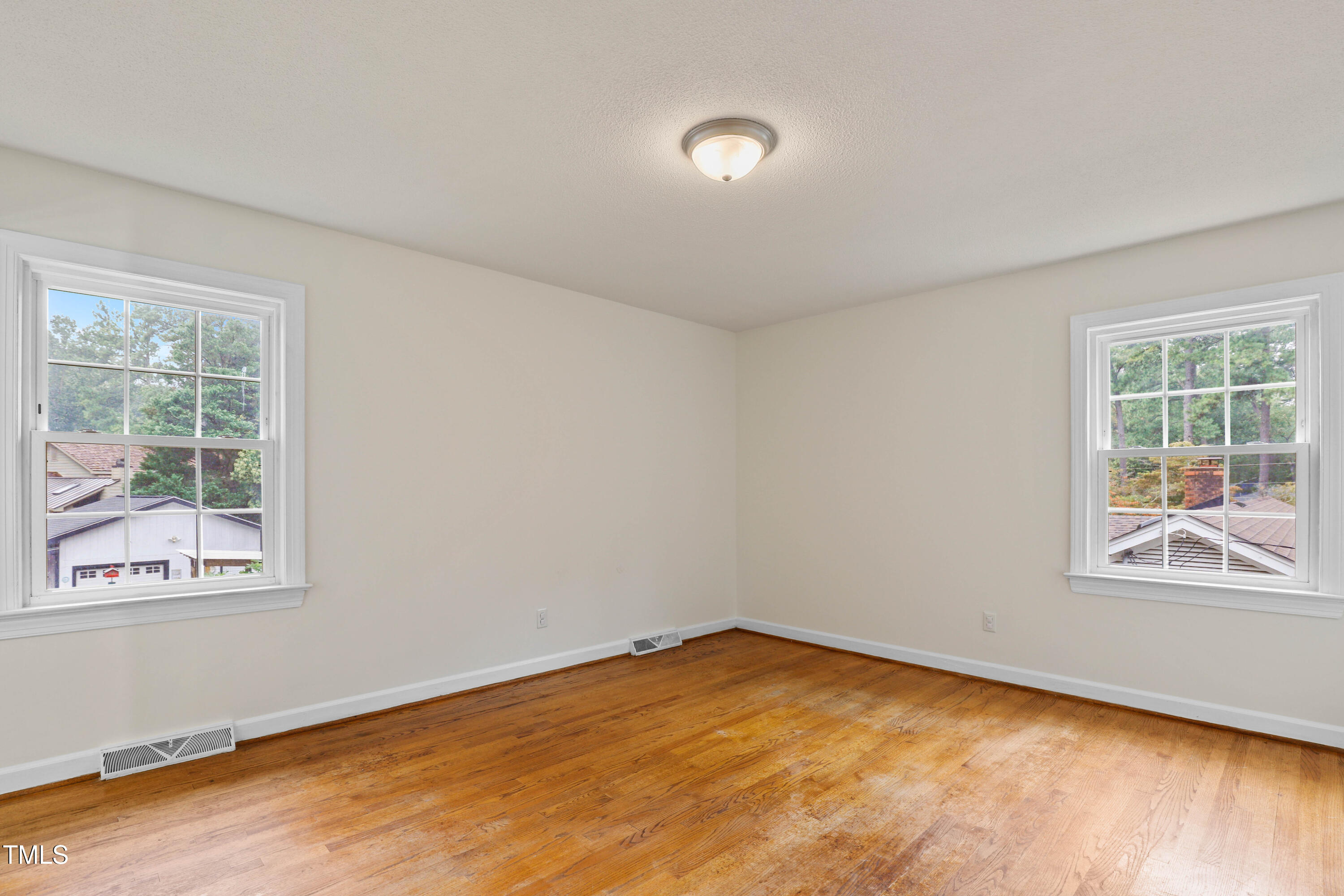 1204 Country Ridge Drive Raleigh, NC 27609 - Photo 12 of 49 an empty room with a window