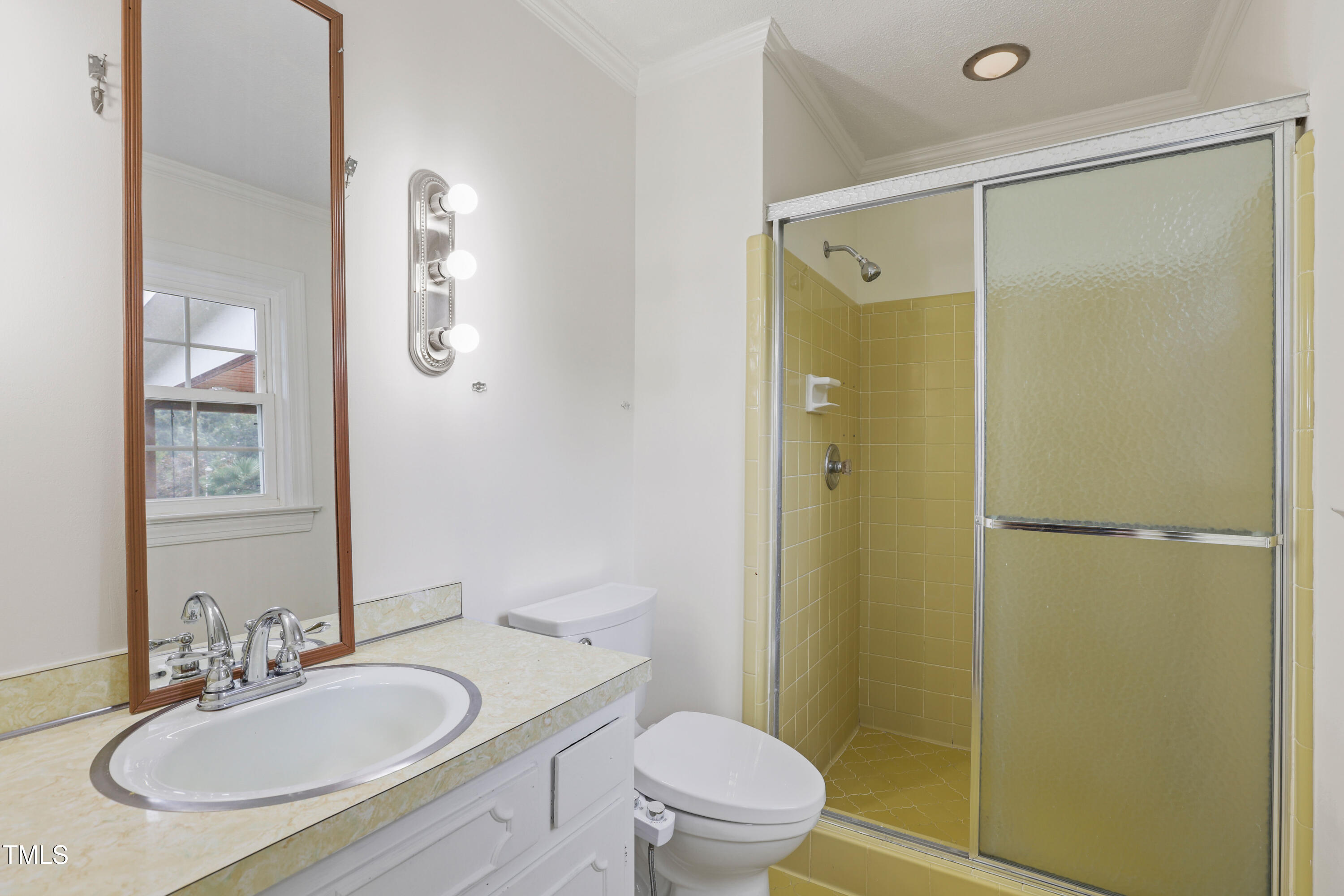 1204 Country Ridge Drive Raleigh, NC 27609 - Photo 14 of 49 a bathroom with a sink toilet and shower
