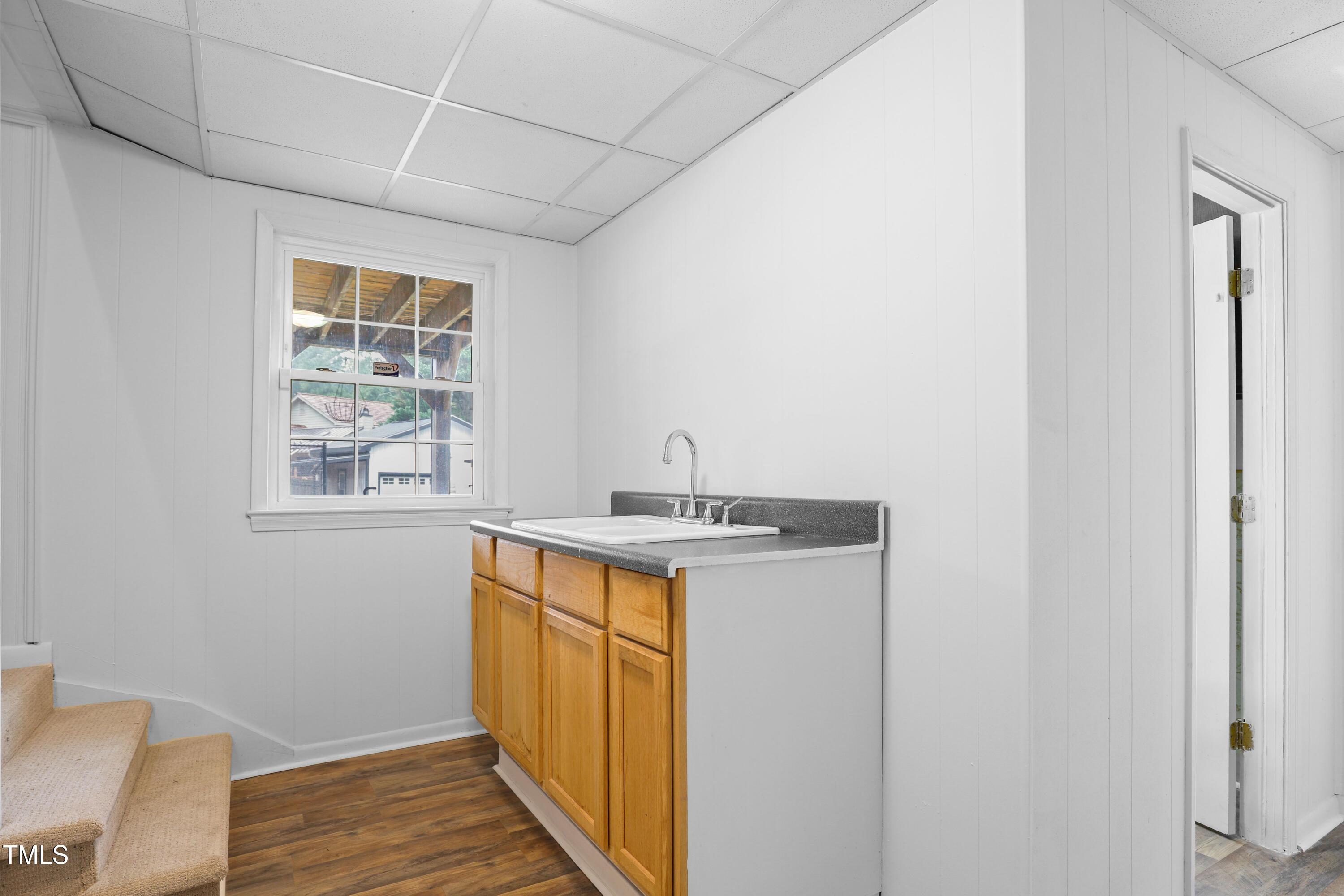 1204 Country Ridge Drive Raleigh, NC 27609 - Photo 22 of 49 a kitchen with a stove a sink and a window
