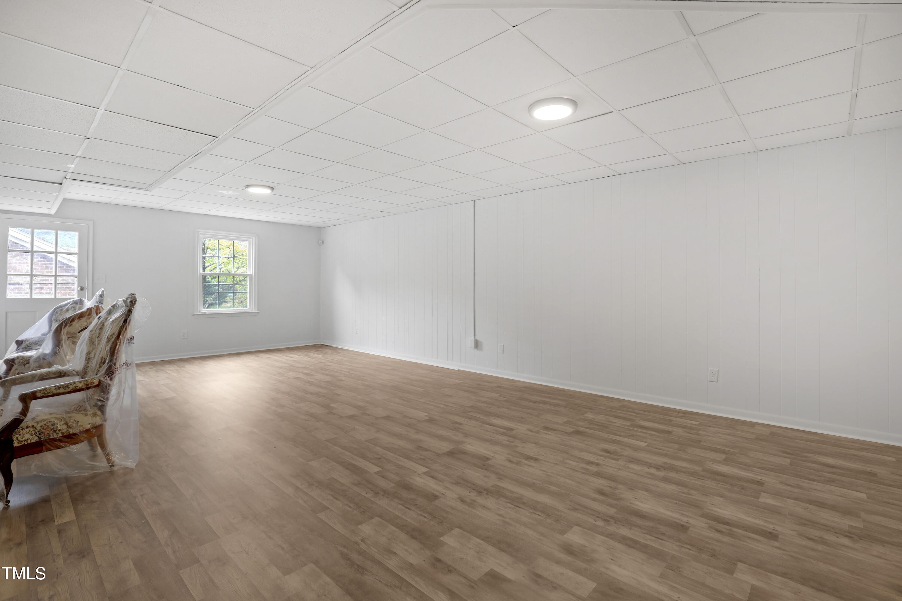 1204 Country Ridge Drive Raleigh, NC 27609 - Photo 27 of 49 wooden floor in an empty room with a window