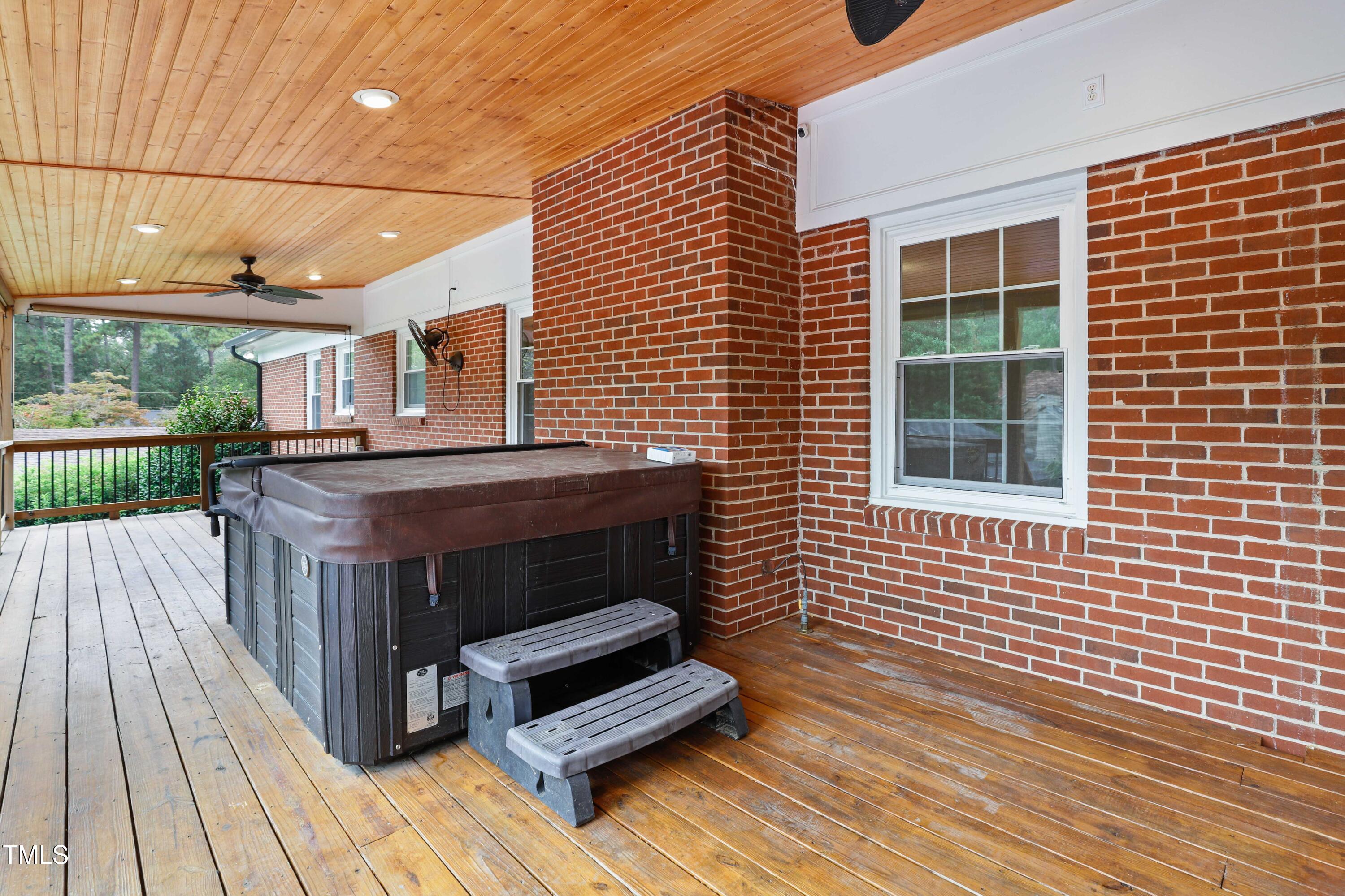 1204 Country Ridge Drive Raleigh, NC 27609 - Photo 32 of 49 a view of a patio with a table and chairs