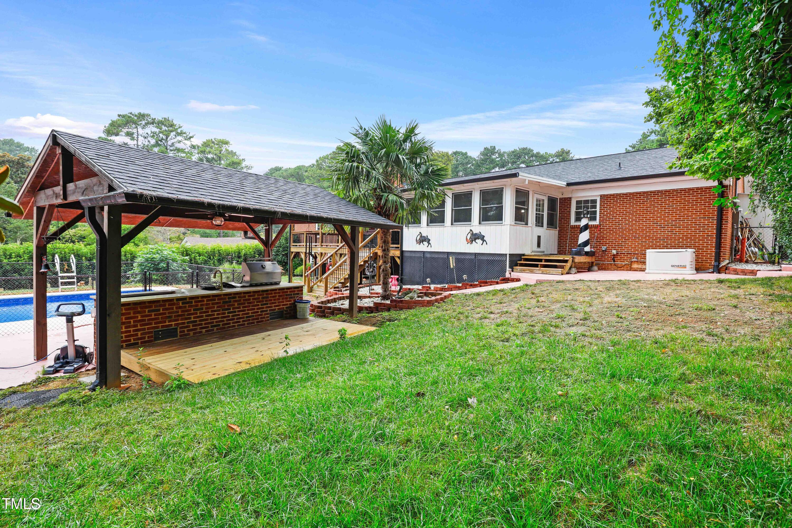 1204 Country Ridge Drive Raleigh, NC 27609 - Photo 38 of 49 a view of a house with backyard porch and sitting area