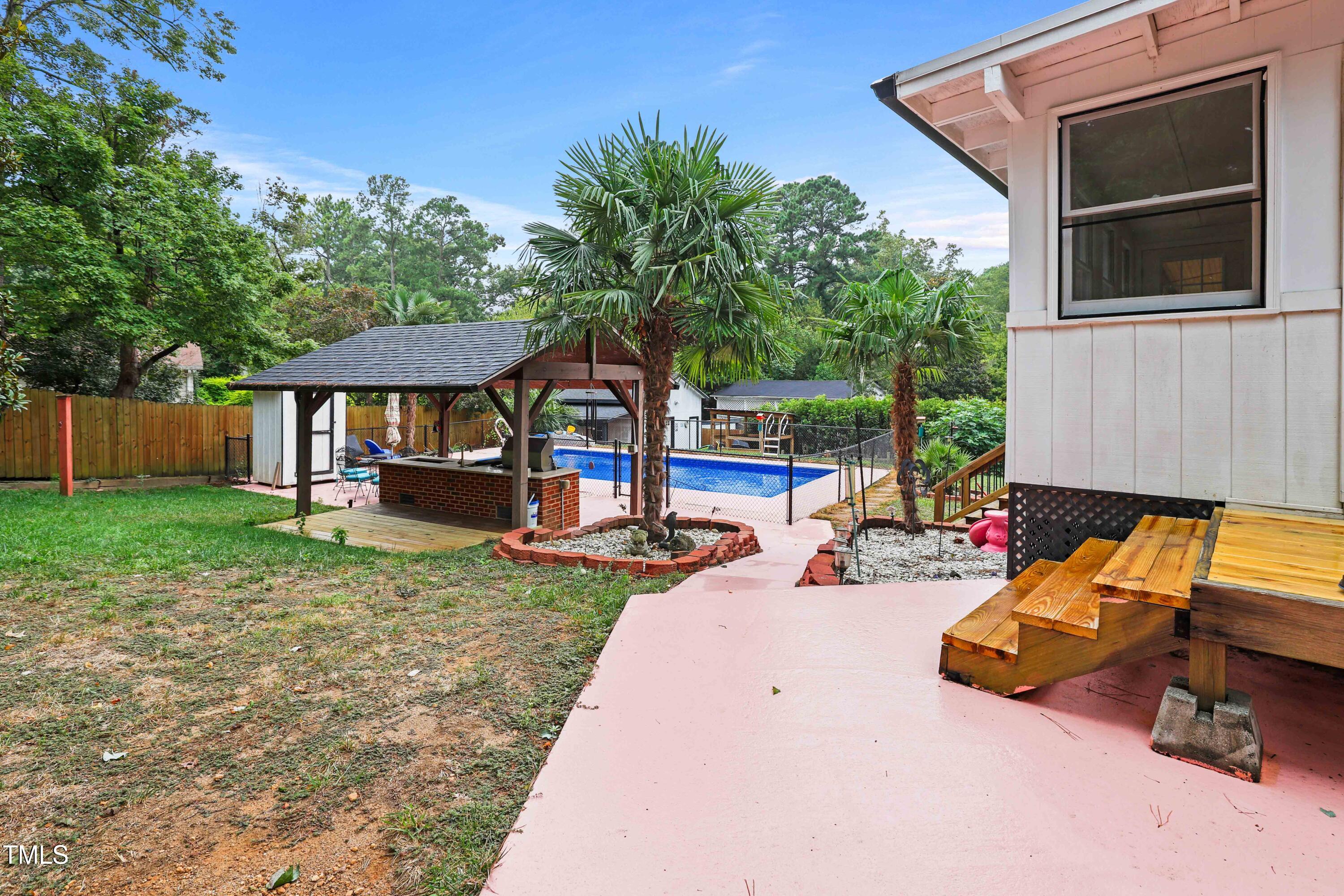 1204 Country Ridge Drive Raleigh, NC 27609 - Photo 39 of 49 a view of a house with backyard porch and sitting area