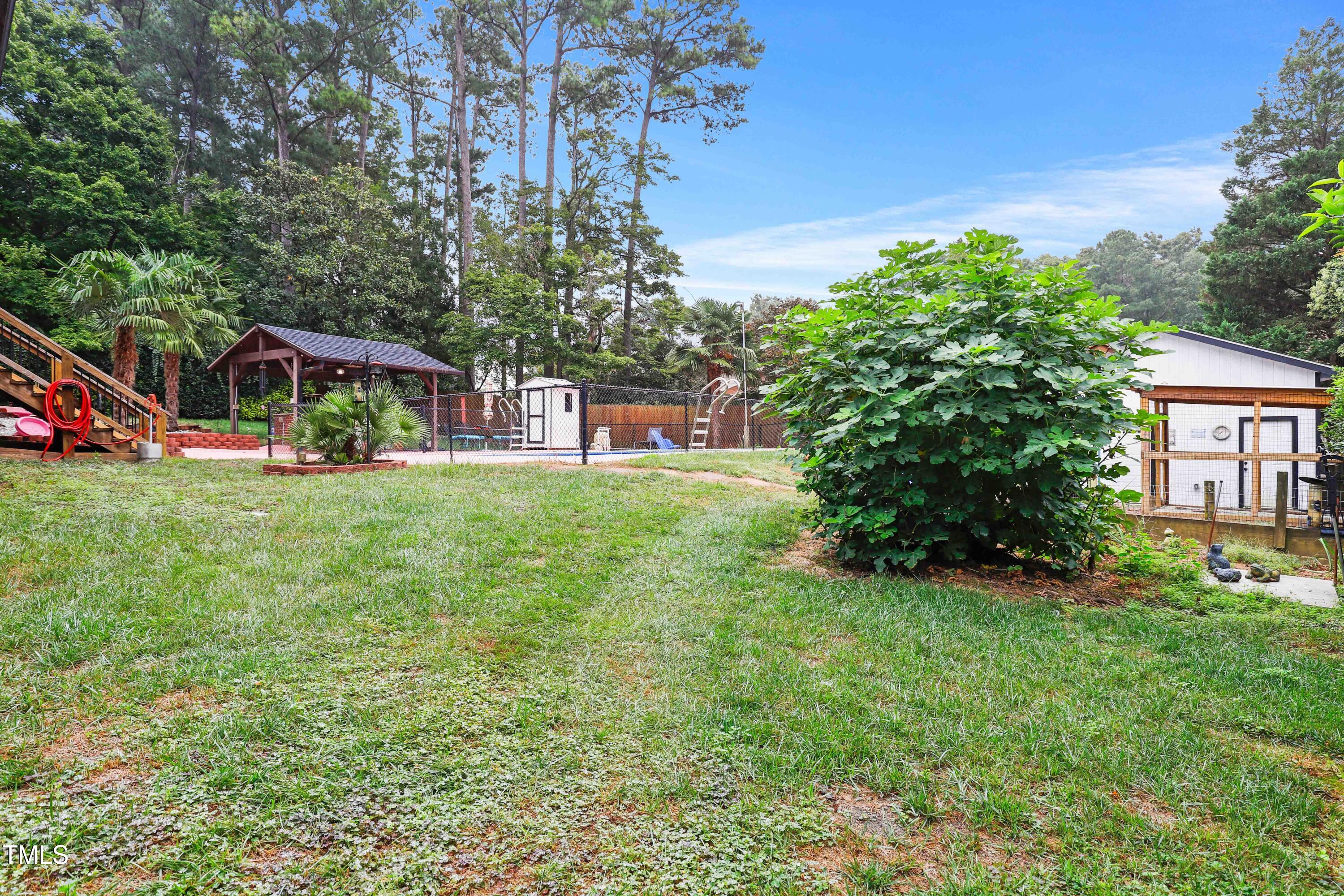 1204 Country Ridge Drive Raleigh, NC 27609 - Photo 42 of 49 a view of a house with a yard and sitting area