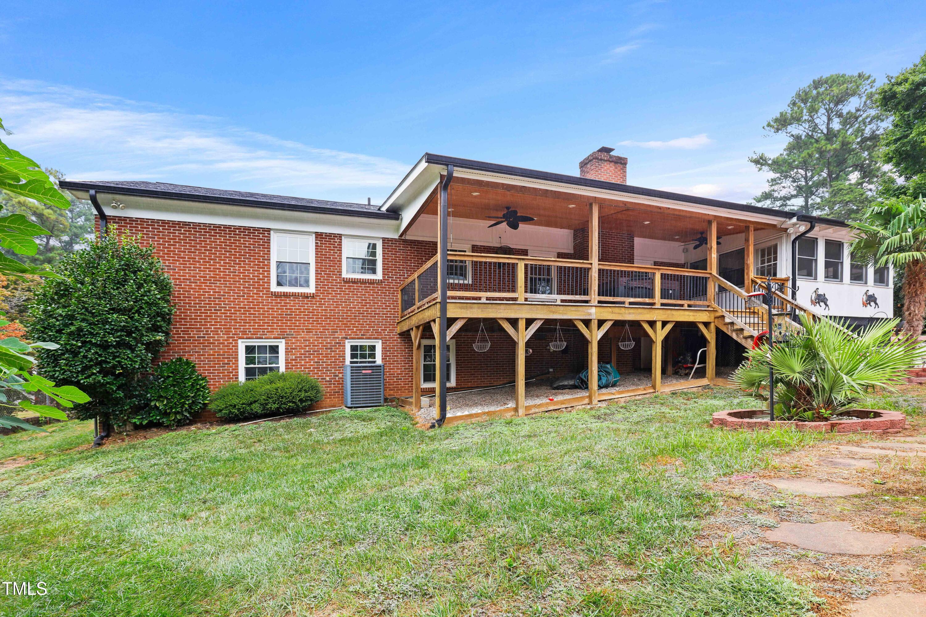 1204 Country Ridge Drive Raleigh, NC 27609 - Photo 43 of 49 a view of a house with yard and sitting area