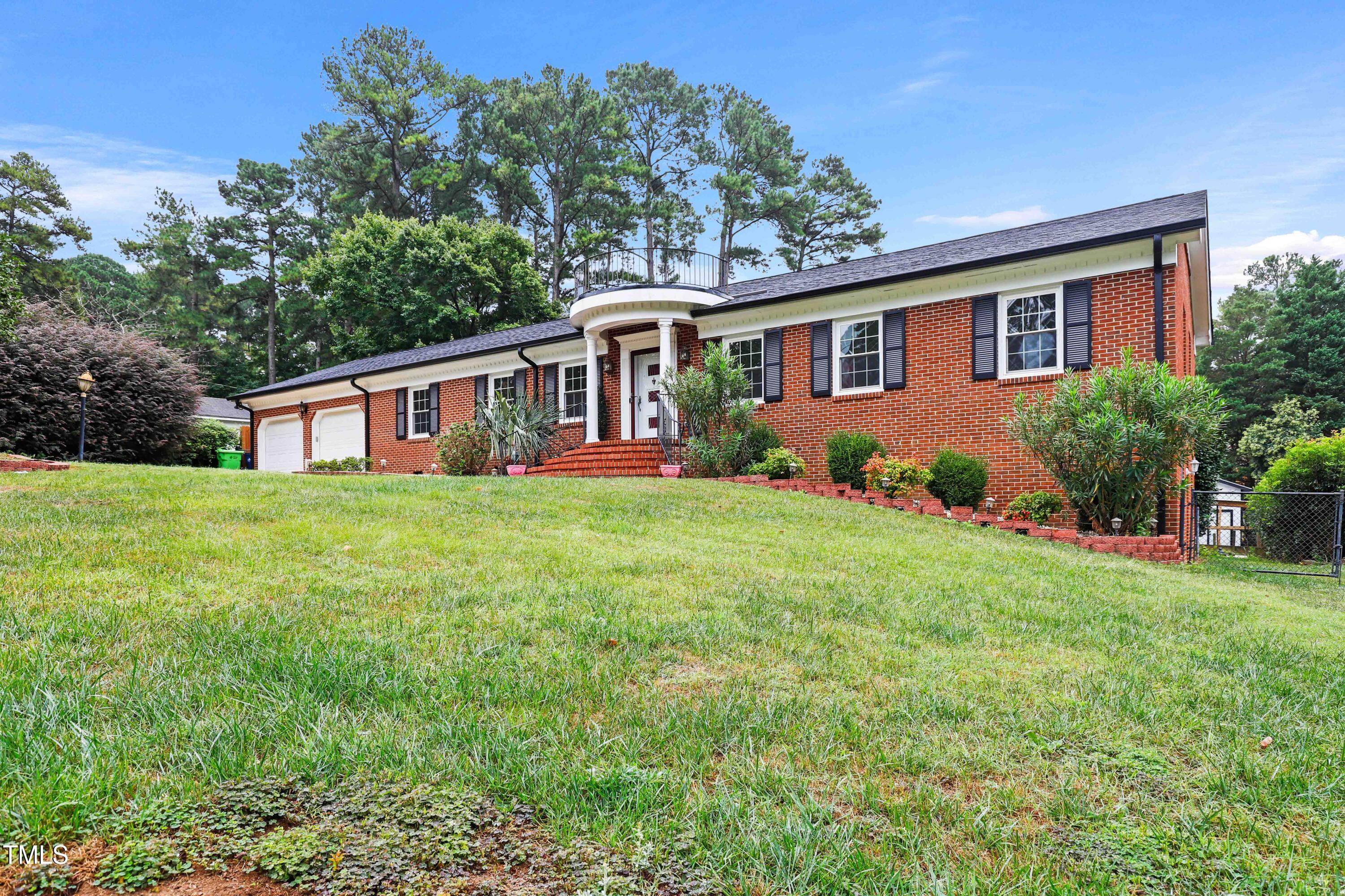 1204 Country Ridge Drive Raleigh, NC 27609 - Photo 49 of 49 a front view of house with yard and green space