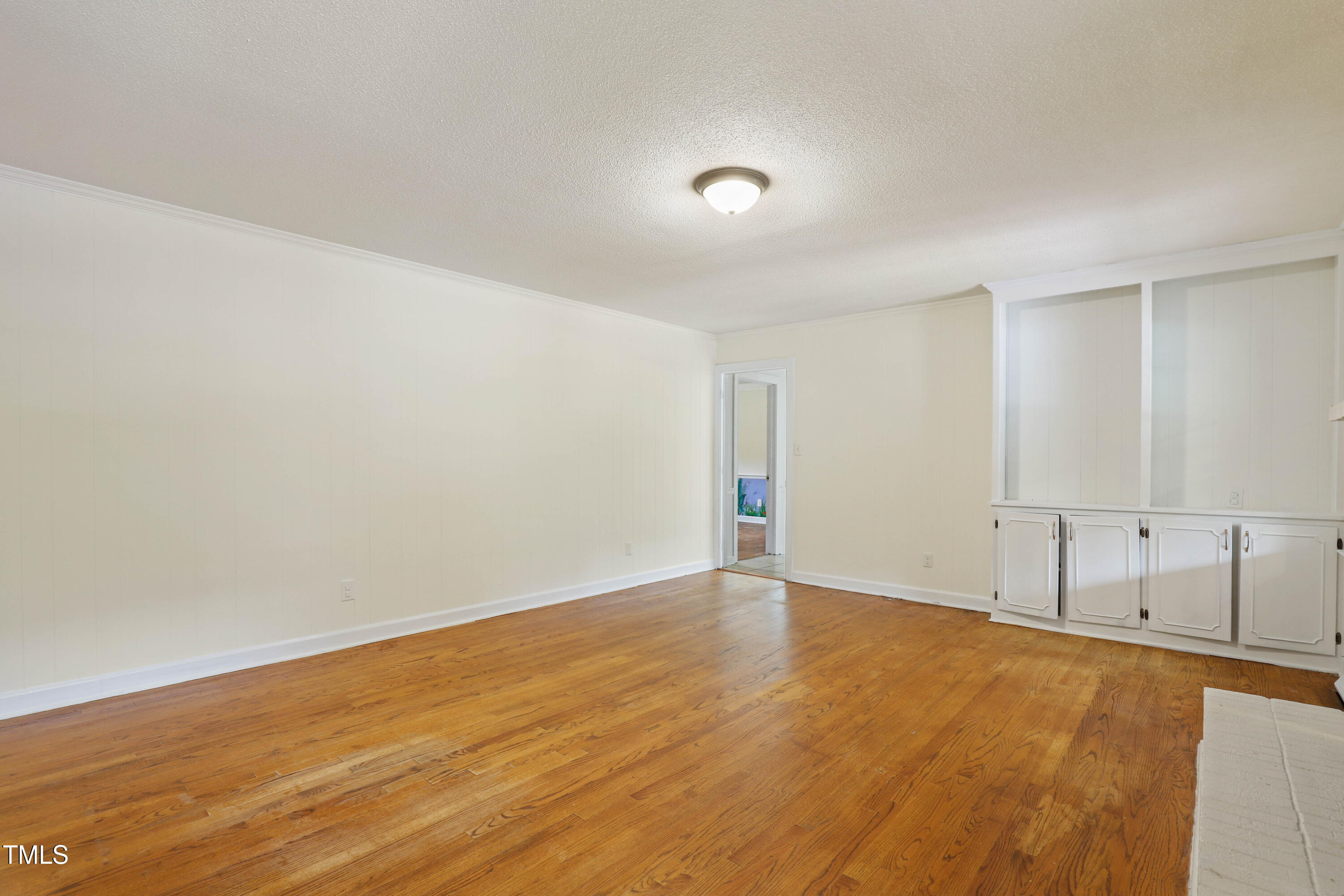 1204 Country Ridge Drive Raleigh, NC 27609 - Photo 8 of 49 a view of an empty room with wooden floor