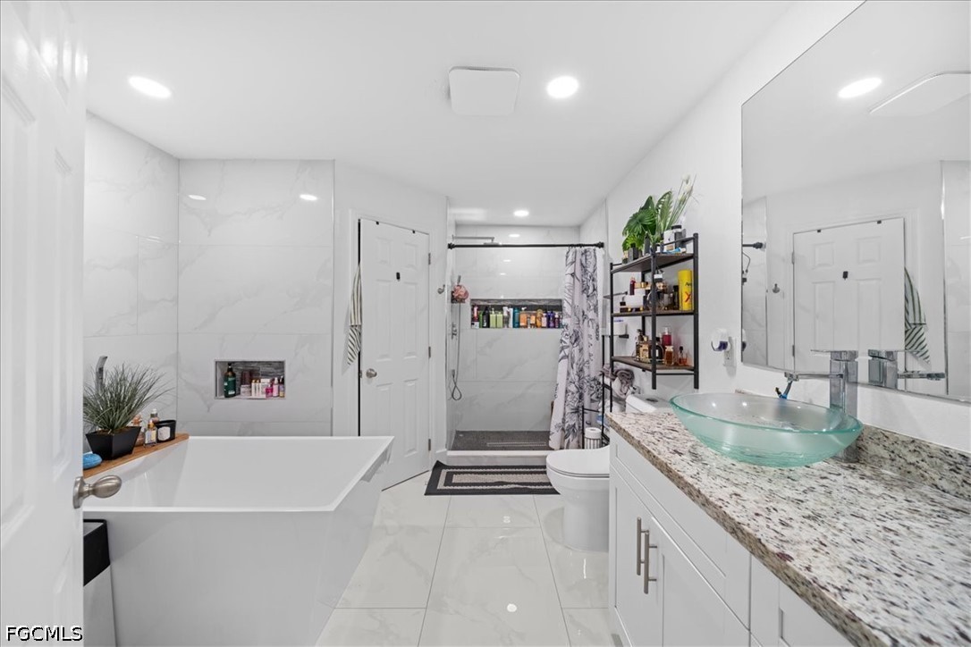 22 Nelson Road South Cape Coral, FL 33991 - Photo 29 of 43 a large white kitchen with a large window