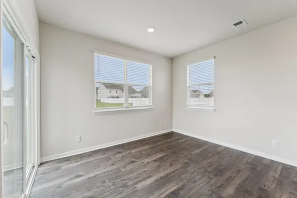 a view of room with wooden floor and window