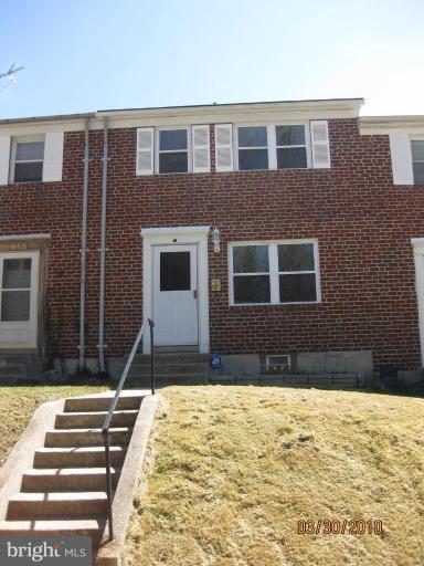 667 South Wickham Road Baltimore, MD 21229 - Photo 1 of 11 a front view of a house with a yard