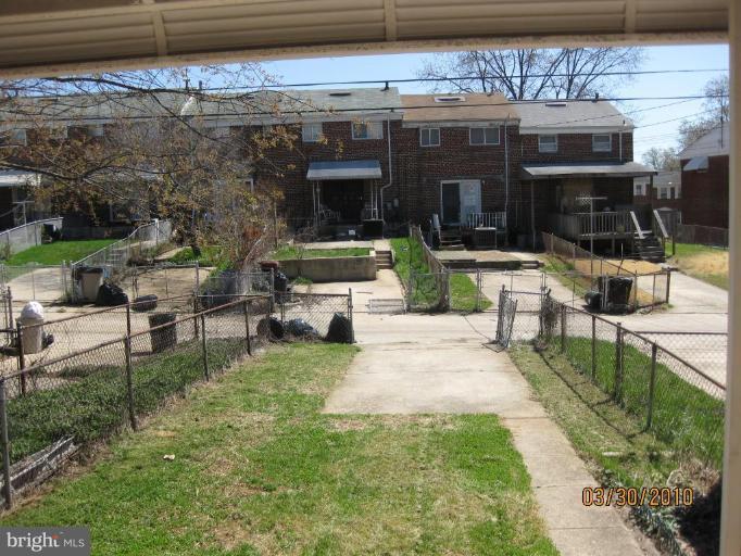 667 South Wickham Road Baltimore, MD 21229 - Photo 9 of 11 a view of a chairs and table in the patio