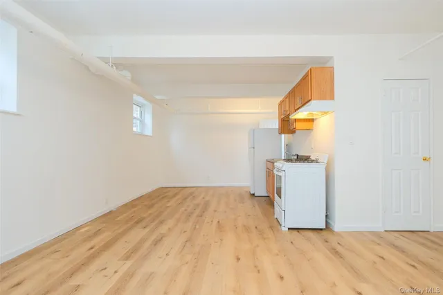 a view of a storage & utility room with a window