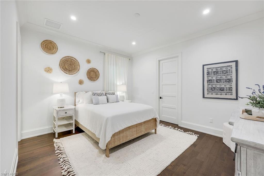 3200 Crayton Road Naples, FL 34103 - Photo 17 of 30 a bedroom with a bed and a window