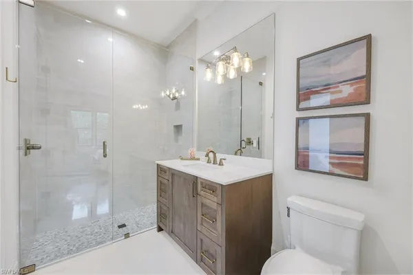 a view of a workspace with furniture and window