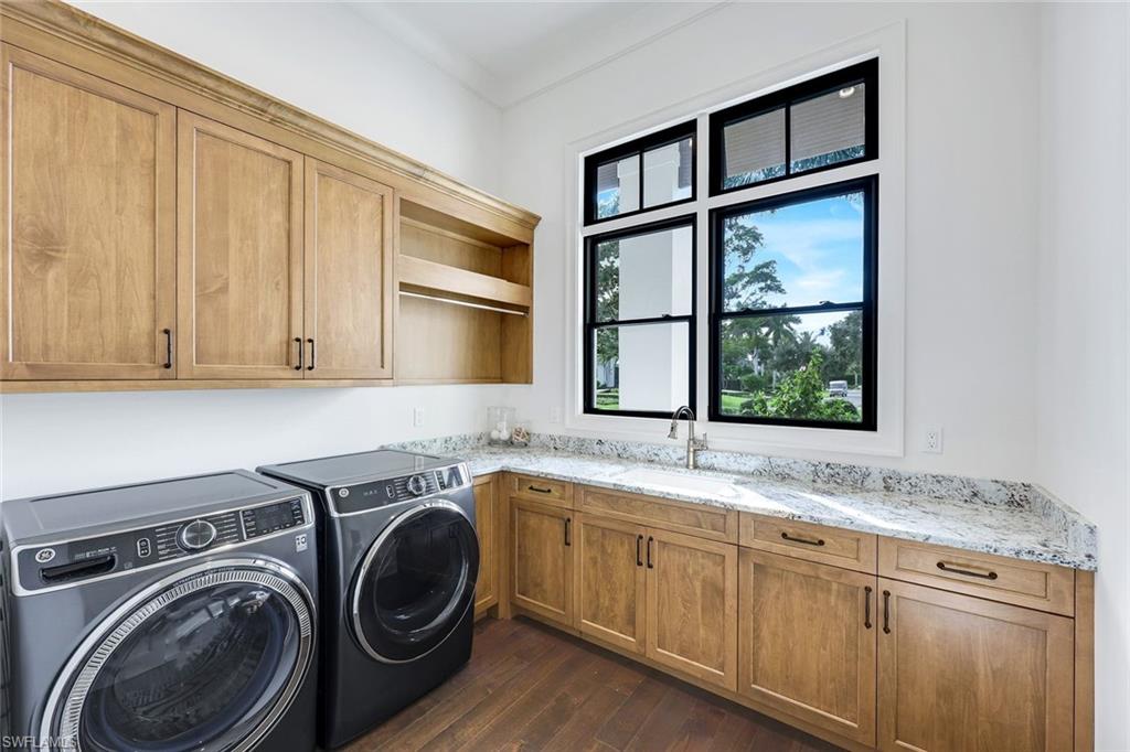 3200 Crayton Road Naples, FL 34103 - Photo 25 of 30 a view of a sink and dishwasher with washing machine