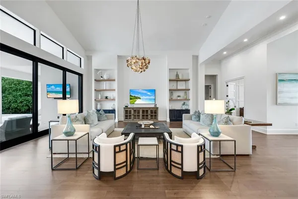 a kitchen with a stove a sink and a refrigerator