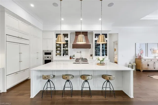 a view of a dining room with furniture wooden floor and chandelier