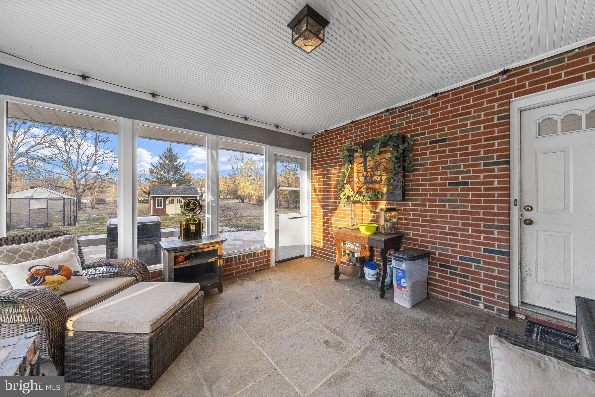 247 Washington Crossing Pennington Road Titusville, NJ 08560 - Photo 20 of 53 a living room with furniture and a floor to ceiling window