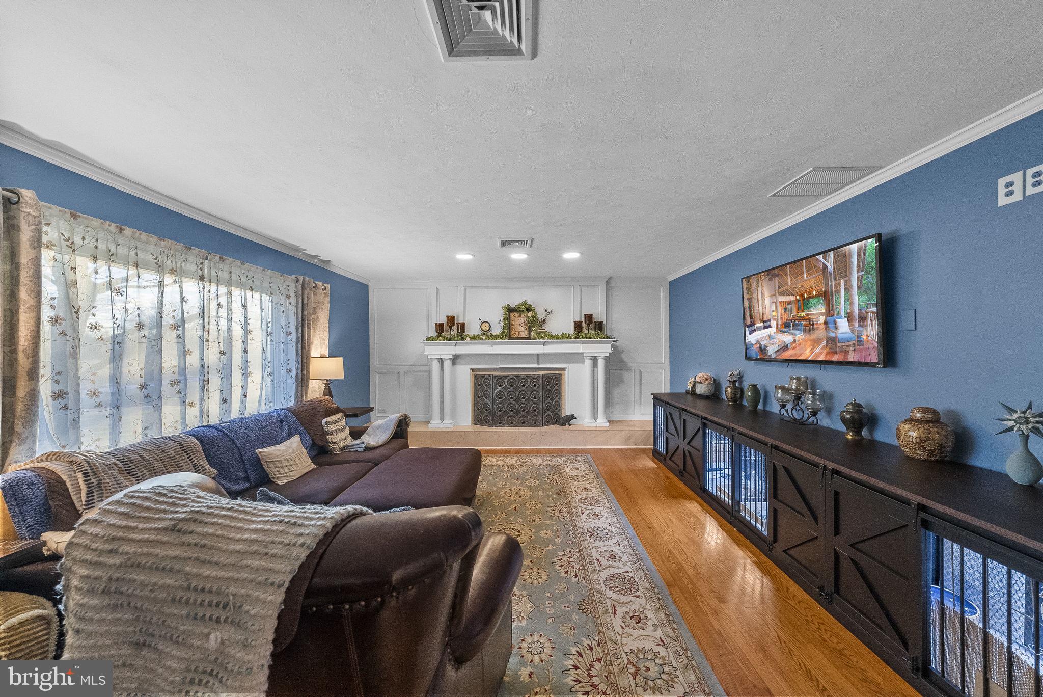 247 Washington Crossing Pennington Road Titusville, NJ 08560 - Photo 22 of 53 a living room with furniture a large window and a flat screen tv