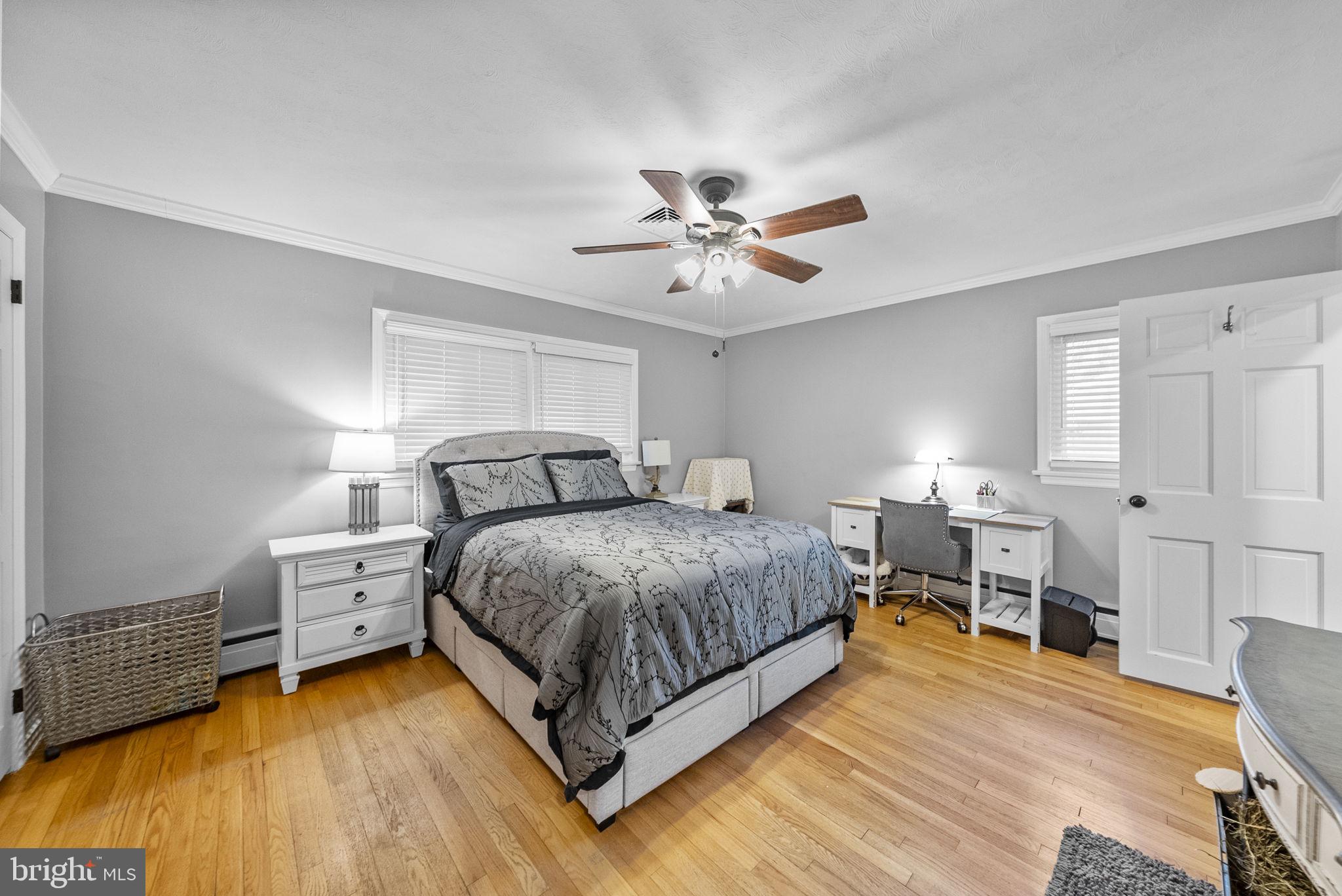 247 Washington Crossing Pennington Road Titusville, NJ 08560 - Photo 35 of 53 a spacious bedroom with a bed and a chandelier