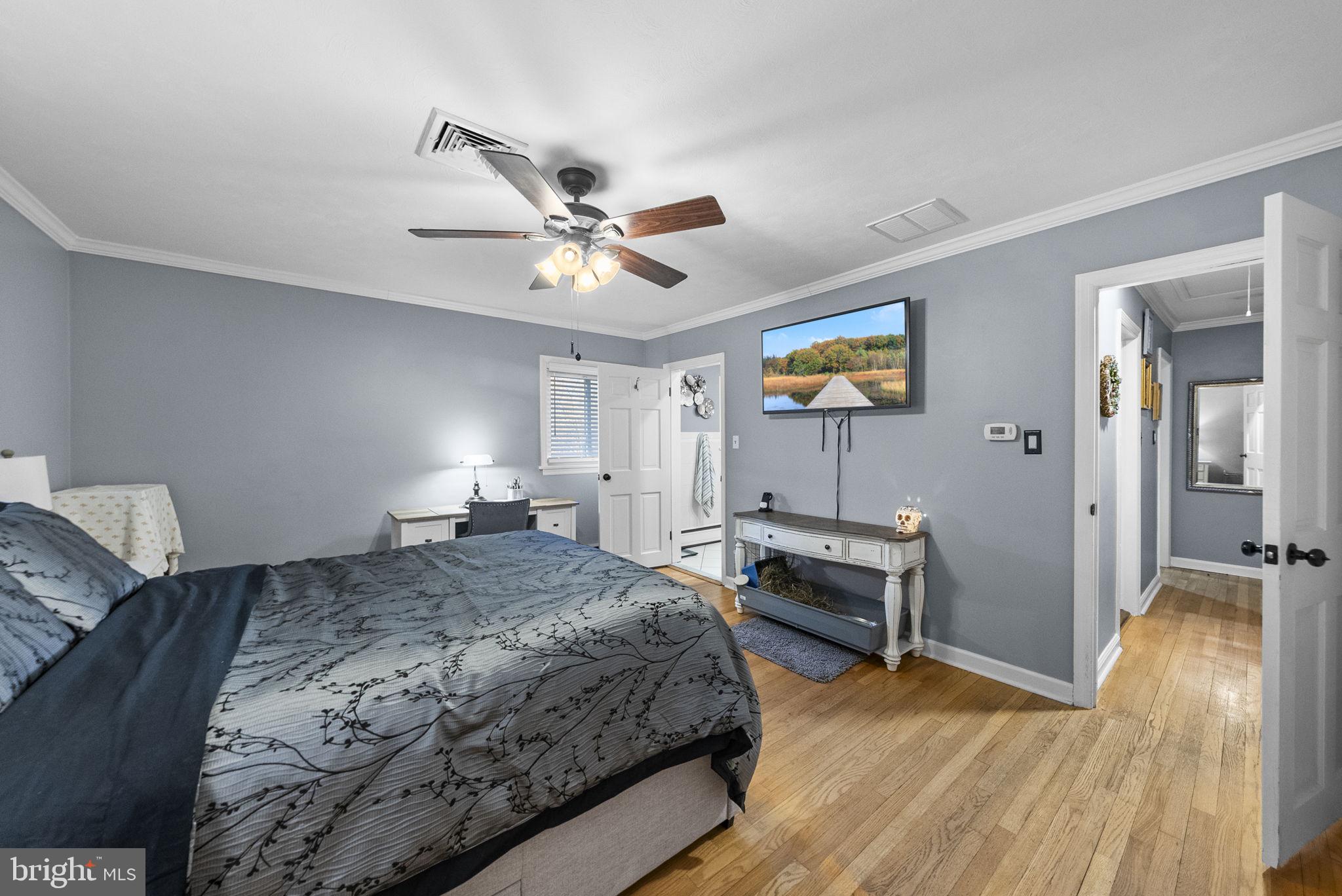 247 Washington Crossing Pennington Road Titusville, NJ 08560 - Photo 39 of 53 a bedroom with a bed and a chandelier