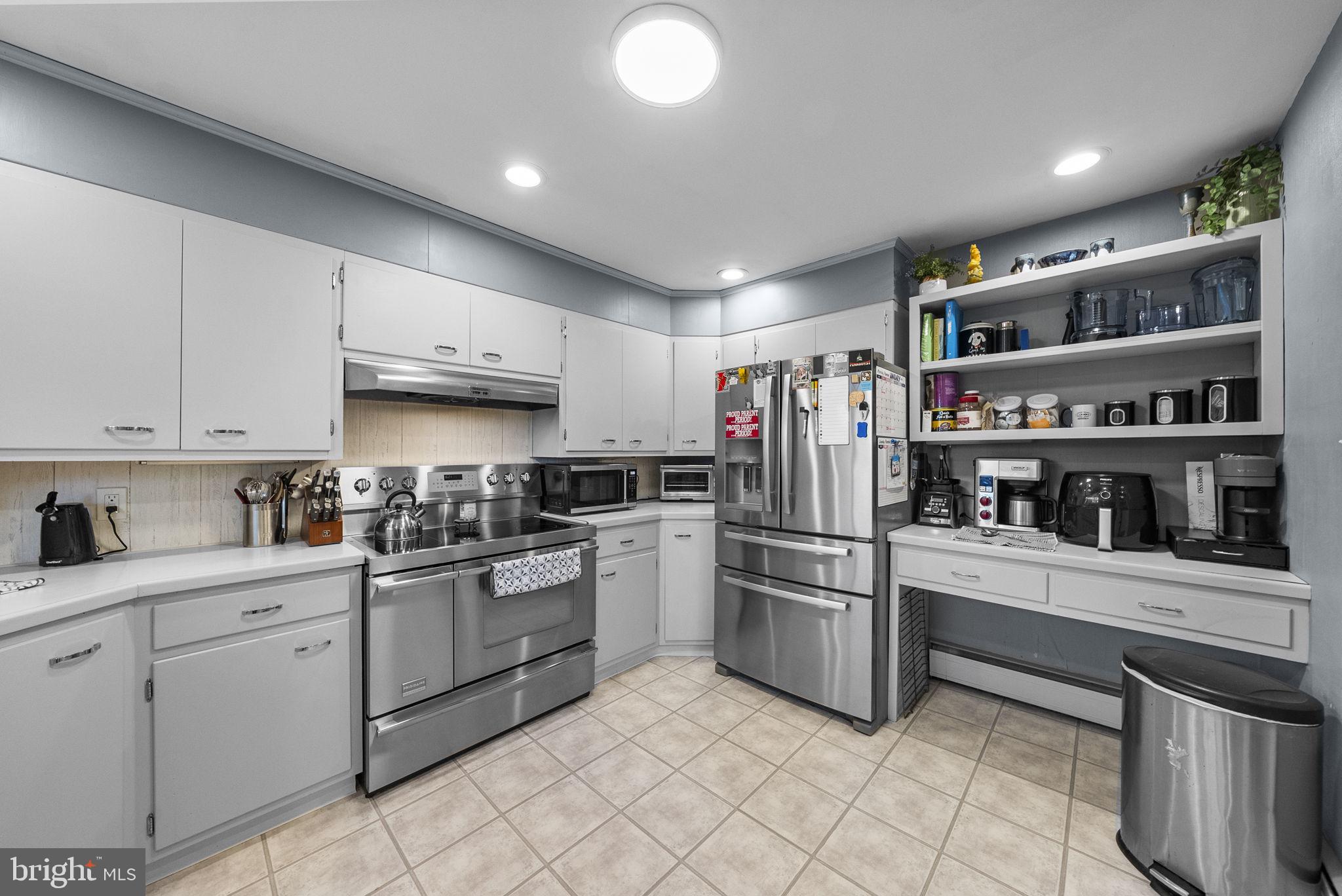 247 Washington Crossing Pennington Road Titusville, NJ 08560 - Photo 41 of 53 a kitchen with stainless steel appliances granite countertop a refrigerator sink and cabinets