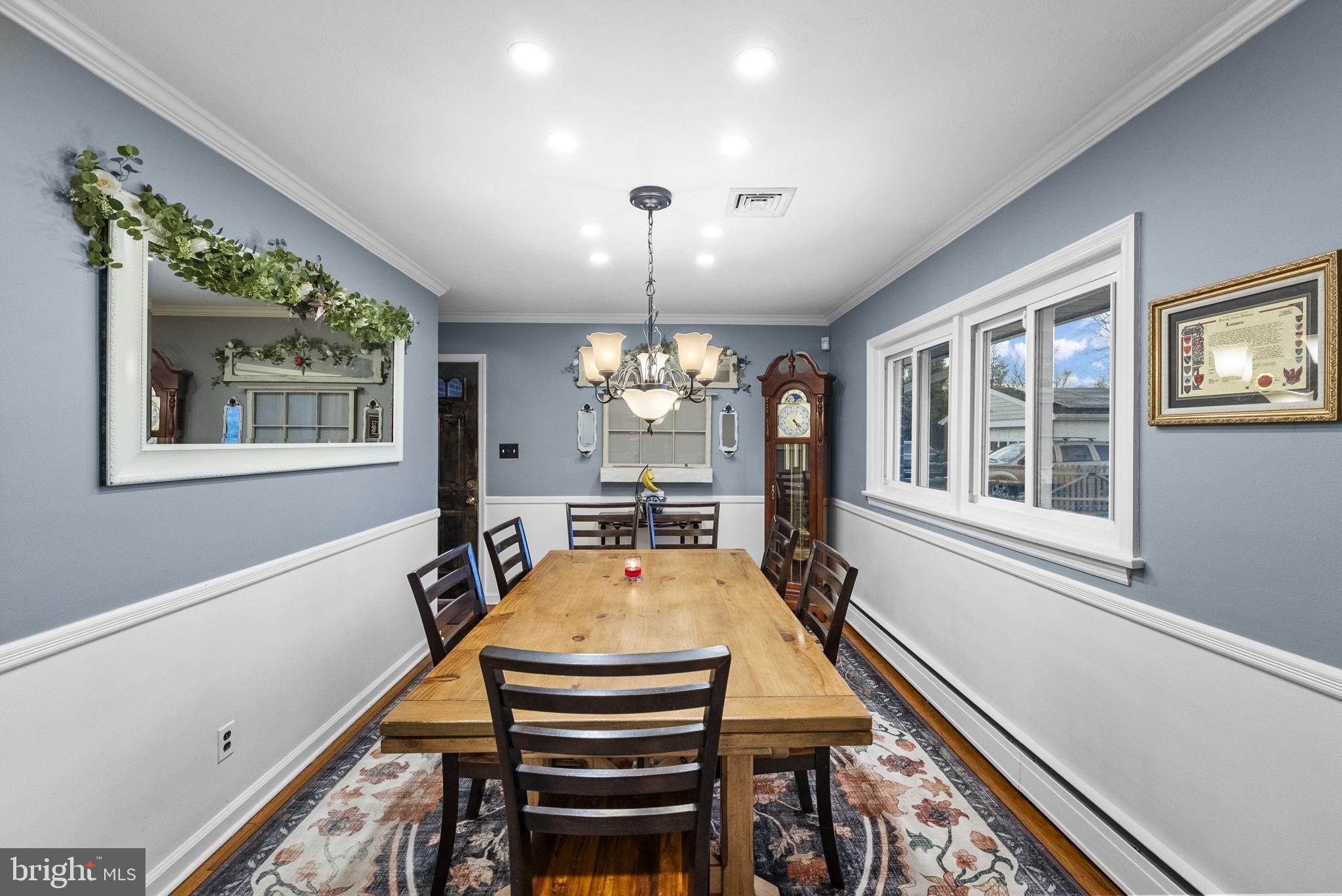 247 Washington Crossing Pennington Road Titusville, NJ 08560 - Photo 43 of 53 a dining room with furniture a chandelier and wooden floor