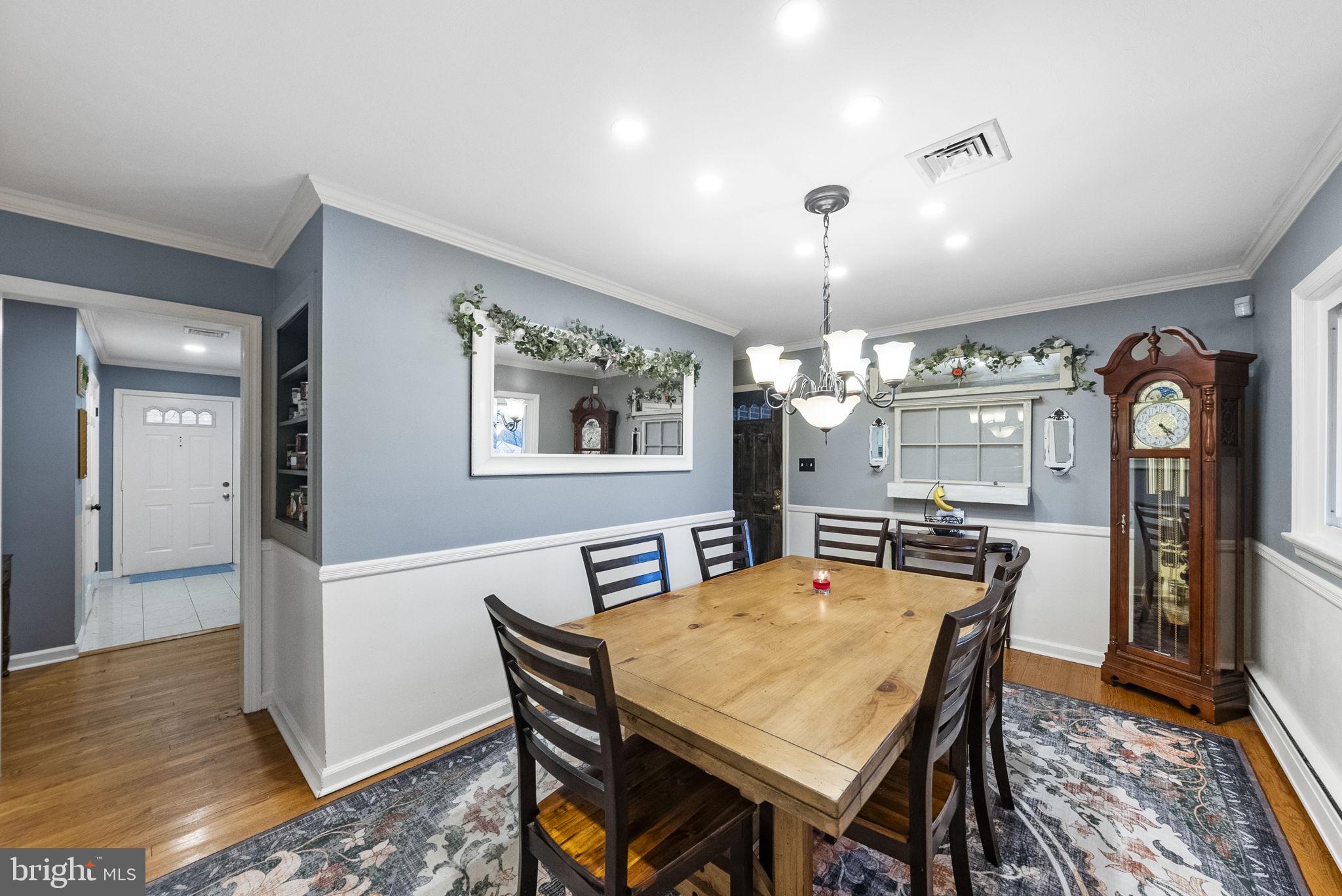 247 Washington Crossing Pennington Road Titusville, NJ 08560 - Photo 45 of 53 a dining room with furniture a chandelier and wooden floor