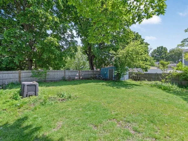 a backyard of a house with lots of green space