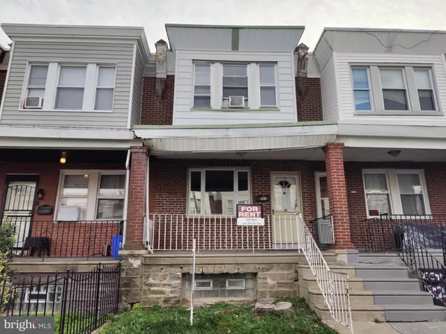 front view of a house with a small deck