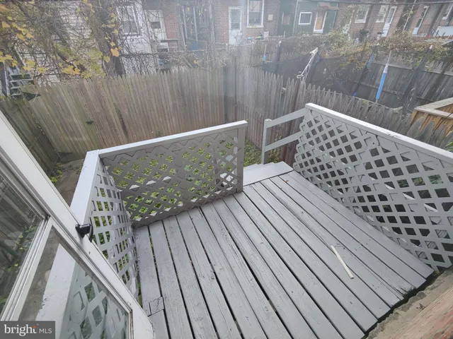 a view of balcony with wooden floor