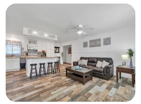 a living room with furniture and a table