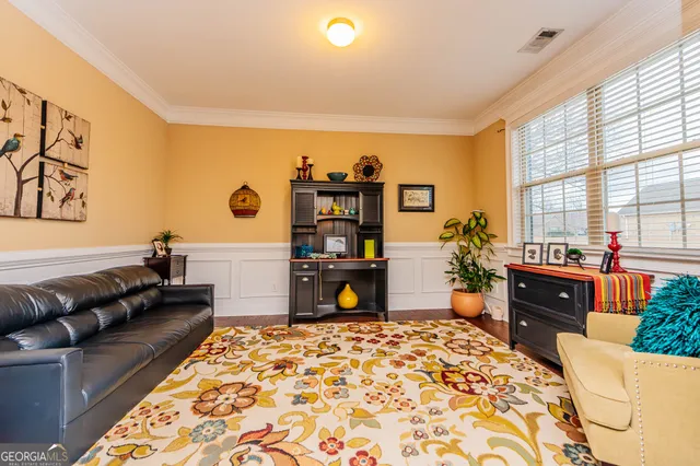 an empty room with closet and a window