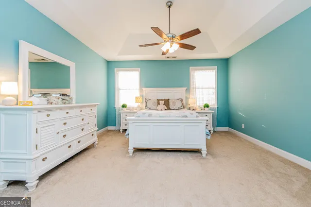 a bed room with a bed and a lamp