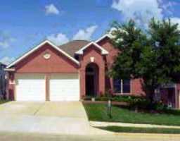 3635 Hawk Ridge Street Round Rock, TX 78665 - Photo 1 of 1 a front view of a house with yard and green space