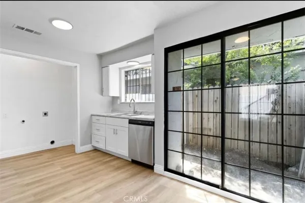 a bathroom with a sink and a window