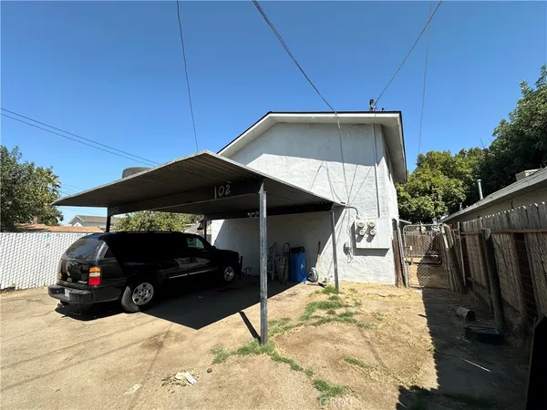 a view of a car parked in the yard