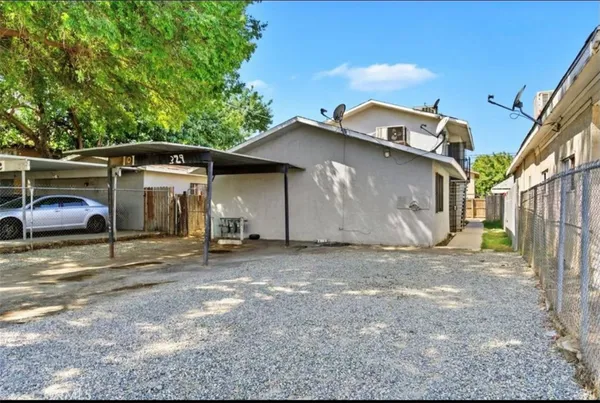 a view of a house with a yard and garage