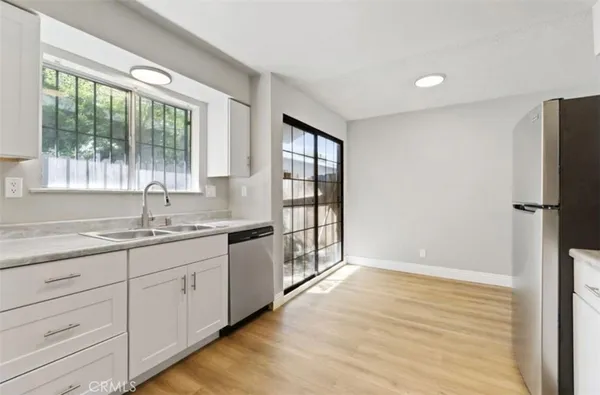 a bathroom with a granite countertop sink mirror and double