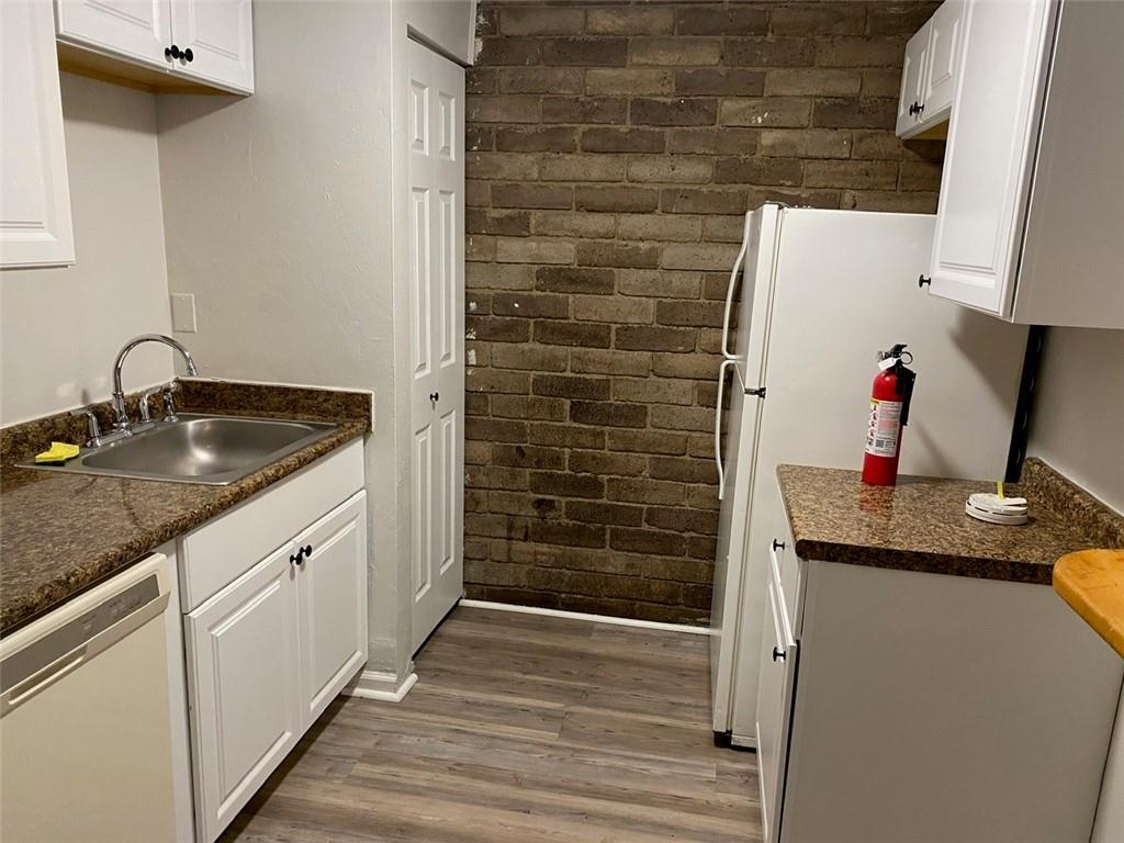 500 Milltown Road, Unit 506 New Kensington, PA 15068 - Photo 12 of 23 a hallway with sink and wooden floor