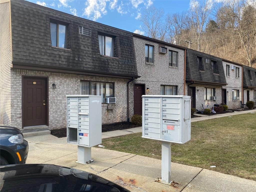 500 Milltown Road, Unit 506 New Kensington, PA 15068 - Photo 3 of 23 a front view of a house with a yard