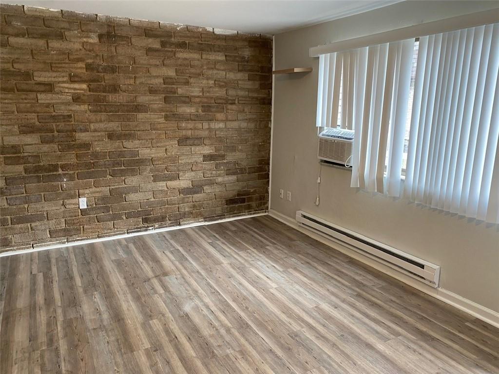 500 Milltown Road, Unit 506 New Kensington, PA 15068 - Photo 4 of 23 a view of a room with wooden floor