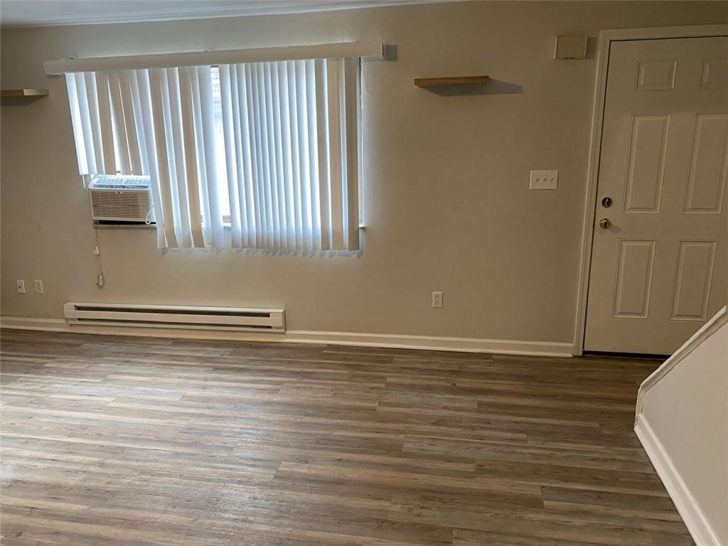 500 Milltown Road, Unit 506 New Kensington, PA 15068 - Photo 5 of 23 a view of a room with wooden floor and a window