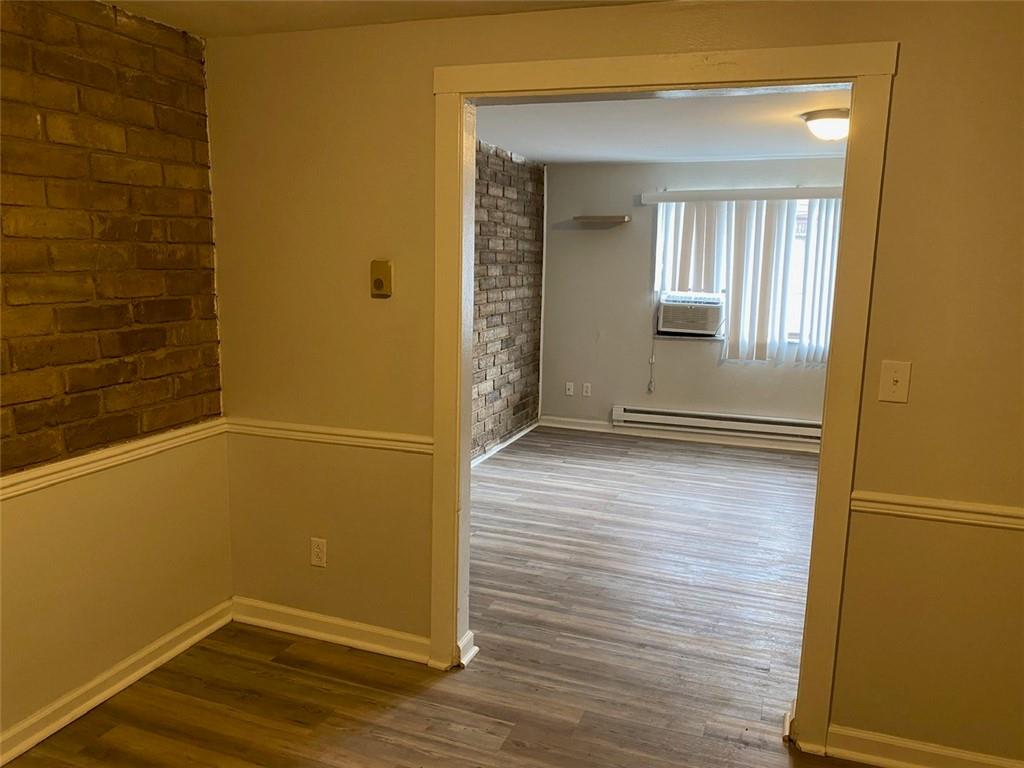 500 Milltown Road, Unit 506 New Kensington, PA 15068 - Photo 9 of 23 wooden floor and window in an empty room