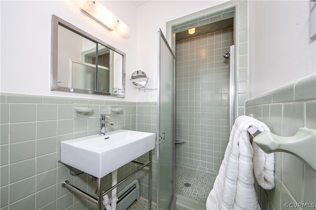 8240 Halstead Road Richmond, VA 23235 - Photo 12 of 35 Full primary bathroom with walk in shower and new fixtures and console sink!