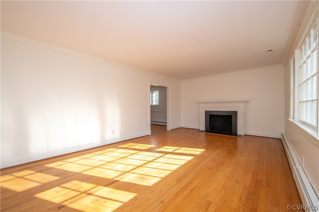 8240 Halstead Road Richmond, VA 23235 - Photo 3 of 35 Living room with hardwood floors and double crown molding has lots of natural light!