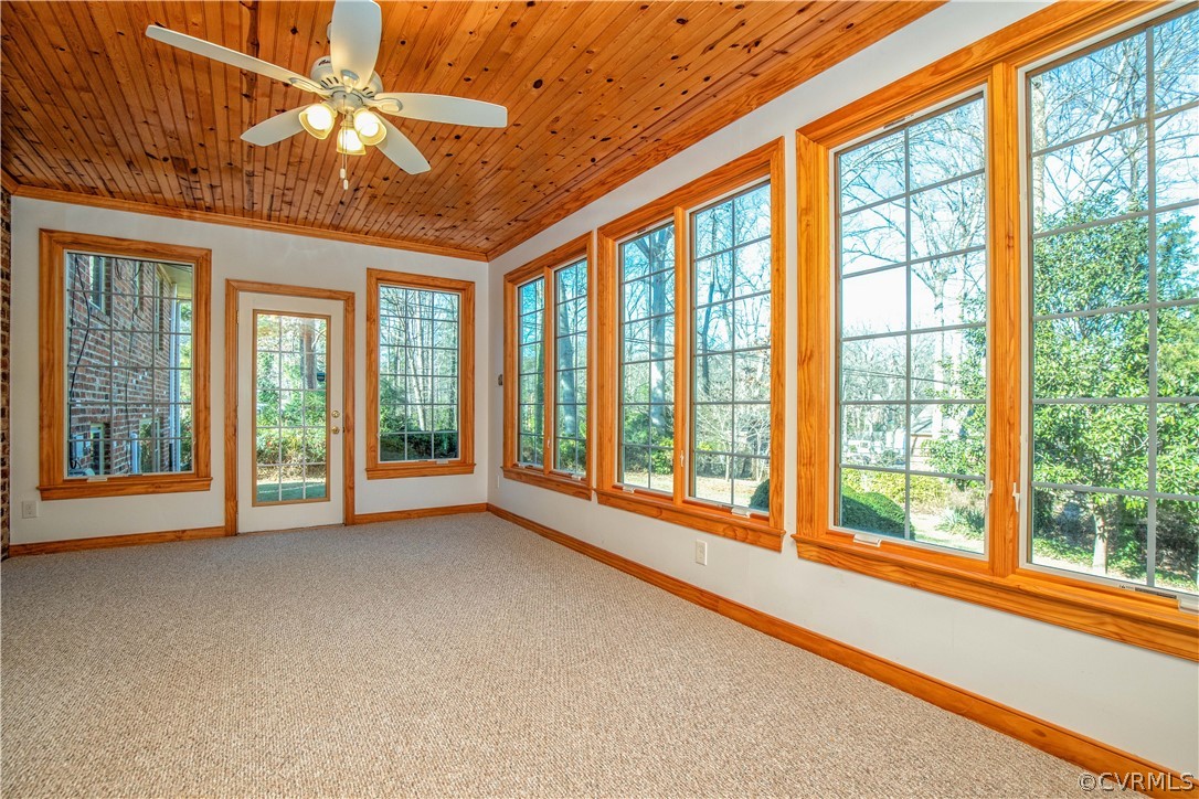 8240 Halstead Road Richmond, VA 23235 - Photo 6 of 35 Florida room with carpet and ceiling fan has back yard entry and new mini split heat and AC unit!
